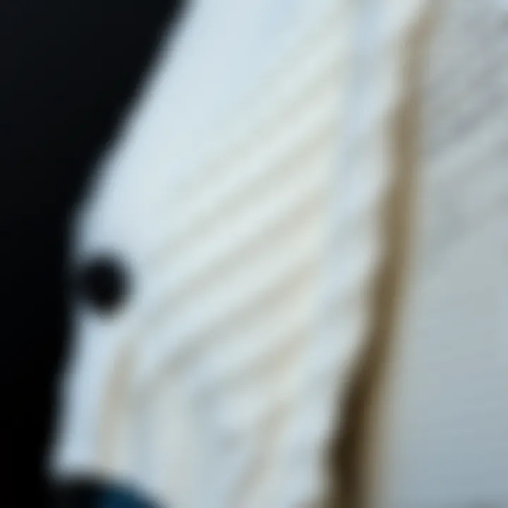 Close-up of textured fabric of a white cardigan