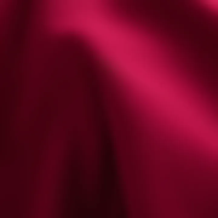 Close-up of the fabric texture of a burgundy tunic