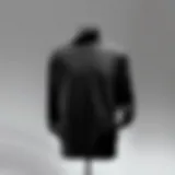 A stylish black sweatshirt displayed on a mannequin against a neutral background