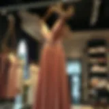 Elegant rose dusty satin dress hanging in a boutique