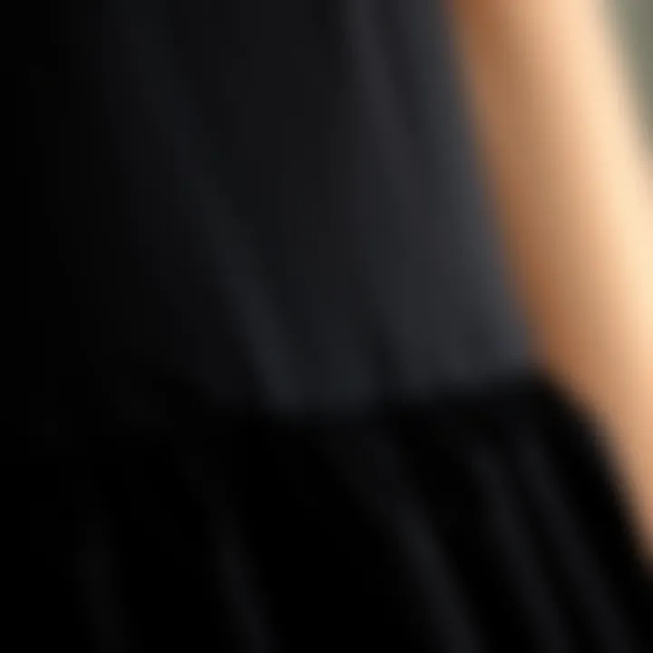 Fabric Detail of Mini Black Dress An artistic close-up of the fabric texture of a mini black dress highlighting its quality.