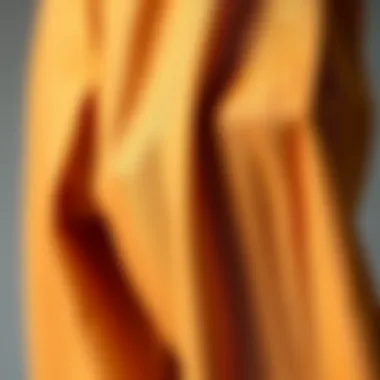 A close-up of different fabric textures for pleated carrot trousers