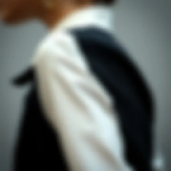 Side view of a tailored black and white shirt with unique design details