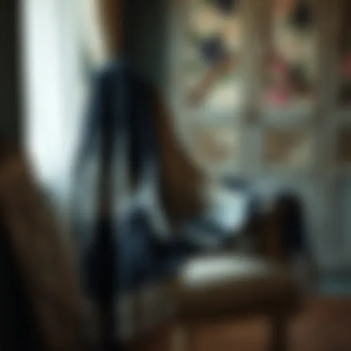 Elegant black and white shawl draped over a vintage chair