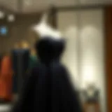 Elegant short black tulle dress displayed on a stylish mannequin