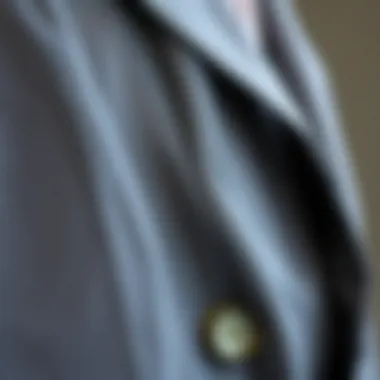 Detailed close-up of fabric texture on a long blazer jacket